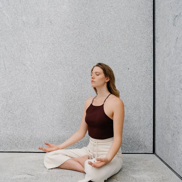 Woman meditating peacefully, symbolizing inner strength and mental clarity.